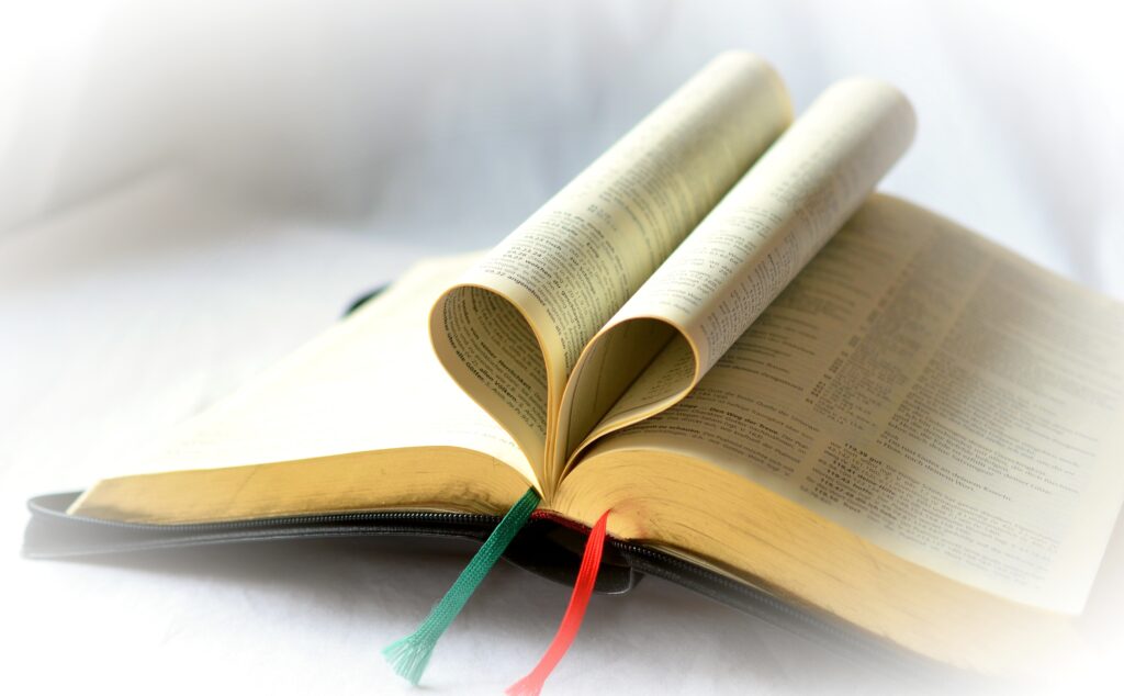 Bible with pages folded into a heart